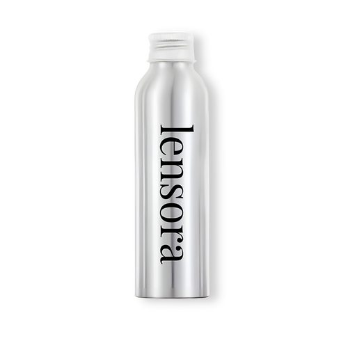 A silver aluminum spray bottle with a white cap, featuring the brand name 'lensora' printed vertically in black serif font, set against a plain white background.
